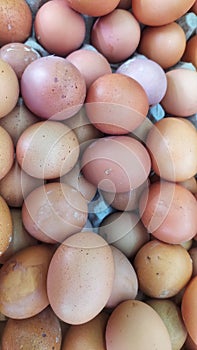 pile of chicken eggs for sale at a traditional market