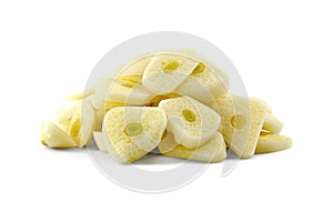 Pile of chopped garlic isolated on a white background. Finely chopped garlic on a white background. Sliced garlic cloves