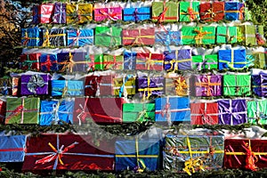 Pile of Christmas gifts colorfully wrapped Merry Christmas