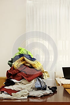 pile of clothes on coffee table