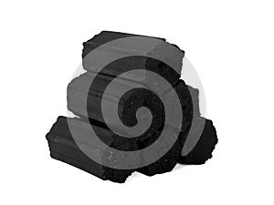 Pile of coconut shell charcoal briquettes isolated on white background, clipping path