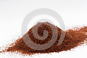 Pile of coffee powder isolated on white
