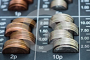 Pile of coins in cash register