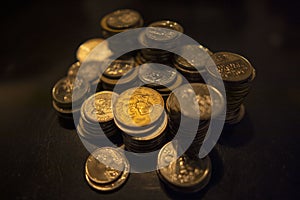 A pile of coins glowed with gold photo