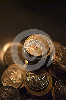 A pile of coins glowed with gold photo