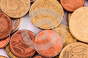 A pile of coins with one of them reading 50