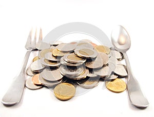 Pile of coins, spoon and fork, thai baht money, finance