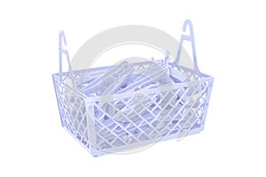 Pile of color plastic cloth clamps inside basket isolated on white background