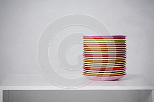 The pile of color plates on a table
