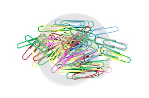Pile of colored paper clips on white background. Decorative paper clips in pink, red, green, red and blue colors