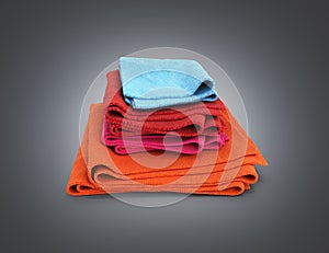 Pile of colored towels isolated on black gradient background 3d