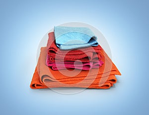Pile of colored towels isolated on blue gradient background 3d