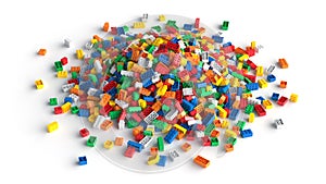 Pile of colored toy bricks isolated on white background