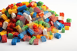 Pile of colored toy bricks on white background