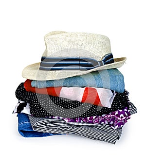 Pile of colorful clothes with a hat