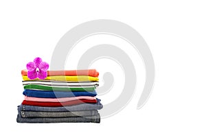 Pile of colorful clothes isolated on white background.