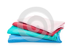 Pile of colorful clothes isolated on white background.