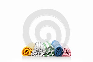 Pile of colorful clothes isolated on white background.