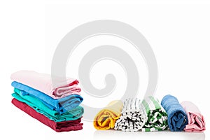 Pile of colorful clothes isolated on white background.