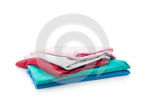 Pile of colorful clothes isolated on white background.