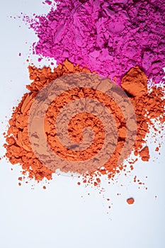 Pile of colorful holi powder on white background