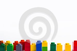 Colorful lego building blocks on a white background. Educational game