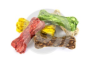 Pile of colorful rawhide dog snack food isolated on white background. Heap of multicolor of rawhide snack for dog isolated