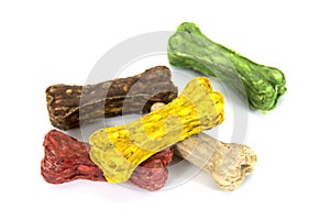Pile of colorful rawhide dog snack food isolated on white background. Heap of multicolor of rawhide snack for dog isolated