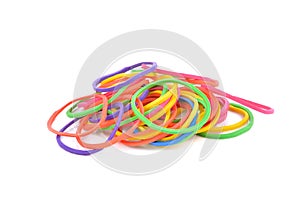 Pile of colorful rubber bands on white background