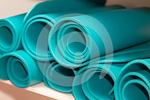 Pile of colorful yoga mat for playing sports. Sport and healthy lifestyles concept