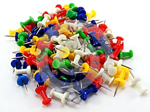 A pile of coloured thumbtacks