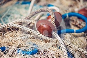 Pile of commercial fishing net with cords and floats