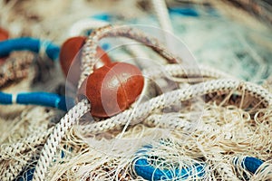 Pile of commercial fishing net with cords and floats