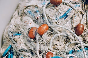 Pile of commercial fishing net with cords and floats