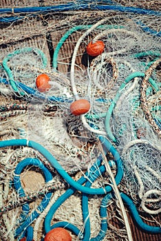 Pile of commercial fishing net with cords and floats