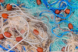 Pile of commercial fishing net with cords and floats