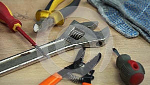 pile of construction tools lying on a wooden table