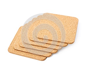 Pile of cork textured coasters isolated