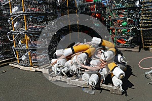 Pile of crab buoys and nets for fishing at the docks in Newport, Oregon