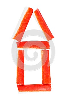 Pile of crab sticks hause shaped isolated on a white