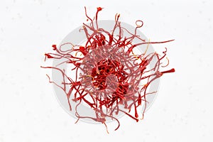 Pile of crocus saffron threads close up on gray