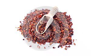 Pile of crushed red chilli pepper dried cayenne pepper flakes isolated on white