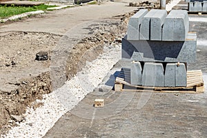 A pile of curbstone prepared for road