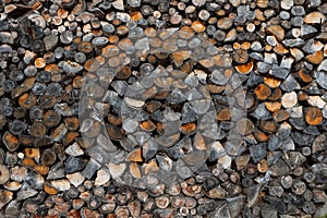 Pile of cut wood as background, texture. Firewood, black and white image