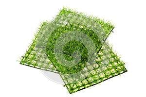 Pile of decorative plastic fake grass tile, isolated on white backgroundPile of decorative plastic fake grass tile, isolated on