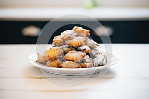 pile of deep-fried oreos on a white plate