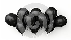 Pile of deflated black balloons on a white background.