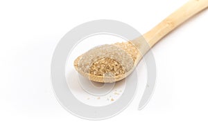 Pile of demerara sugar in a spoon. Top view