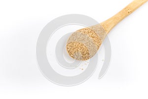 Pile of demerara sugar in a spoon. Top view