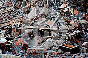 Pile of demolition rubble. Gray rubble at a building site. Concrete rubble debris on construction site